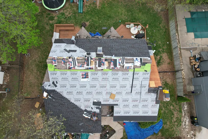 Roof replacement in progress: new underlayment going on